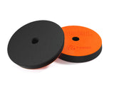 Two polisher pads, one black and one orange with ADBL branding, on a white background.